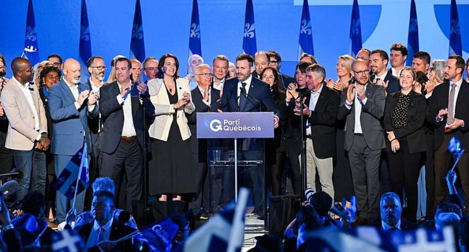 Parti Quebecois Leader Paul St-Pierre Plamondon, centre, speaks to supporters after winning the provincial election in Montreal, Quebec on Monday, 5 October, 2026. - Graham Hughes/The Canadian Press - Graham Hughes