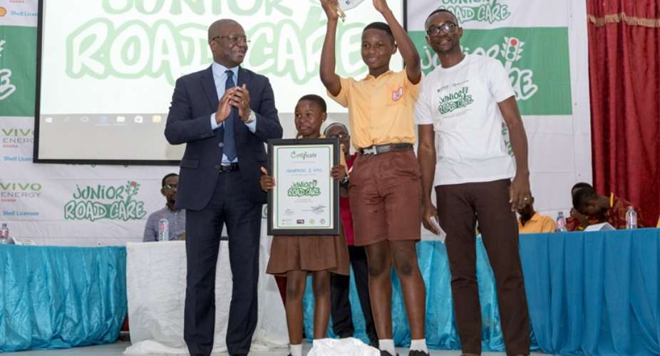 Mr. Ben Hassan Ouattara, Managing Director of Vivo Energy Ghana with winners of the road safety quiz competition, Mamprobi 1 Basic School