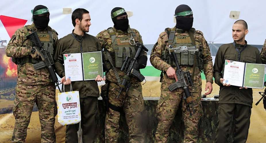Omer Shem Tov and Omer Wenkert are released as part of a ceasefire prisoner swap between Hamas and Israel, in Nuseirat, Gaza, 22 February, 2025. -  Ramadan Abed / Reuters