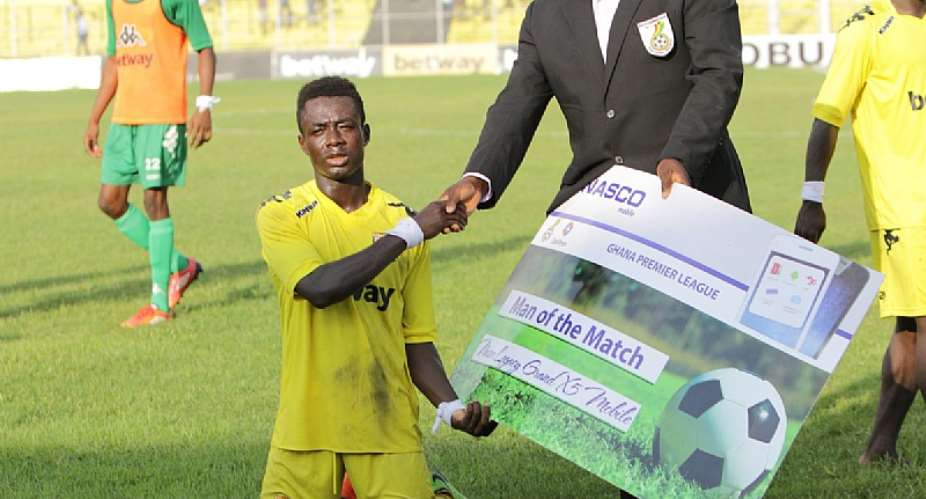 Amos Addai receiving man of the match award