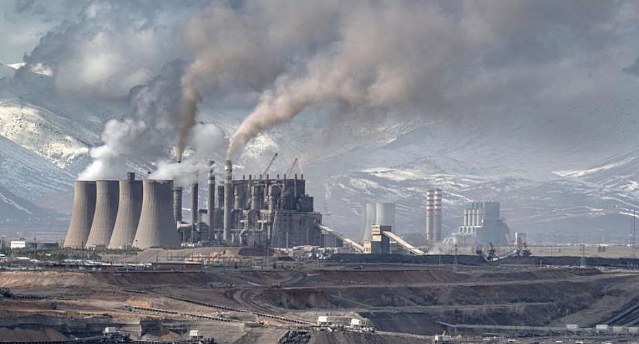Mining vehicles extract coal from a lignite coal mine, as the Elbistan thermal power plant, is seen in the background in Elbistan on 11 February 2026. -  Ozan KOSE / AFP/File