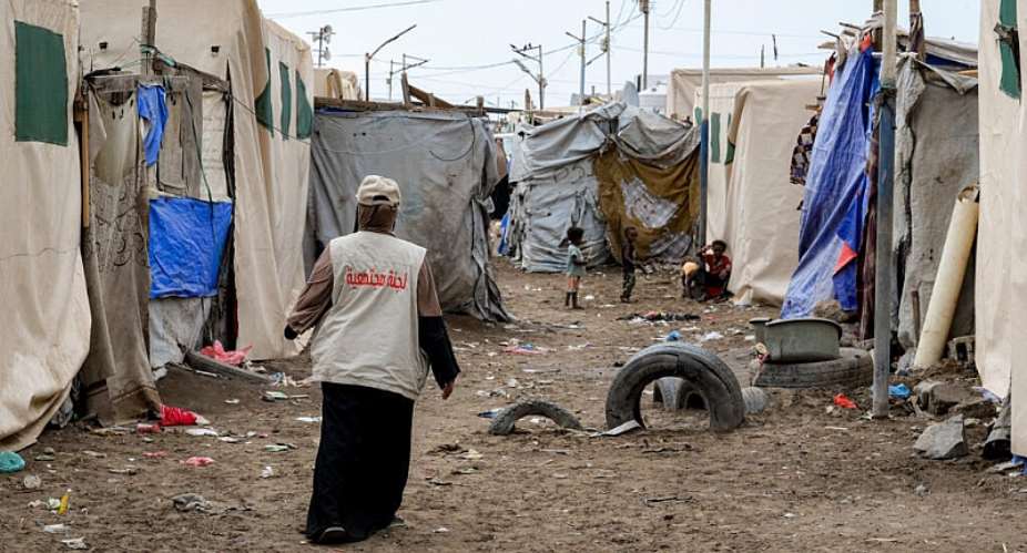A humanitarian worker at a temporary camp for internally displaced people at Shawkani school, north of Aden, Yemen, on 15 September 2026. -  AFP
