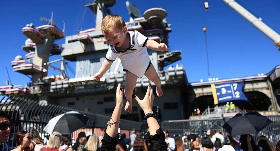 Families welcomed back service members aboard the USS Abraham Lincoln as it arrived at its home port of San Diego after almost a year away. -  David Swanson, AFP