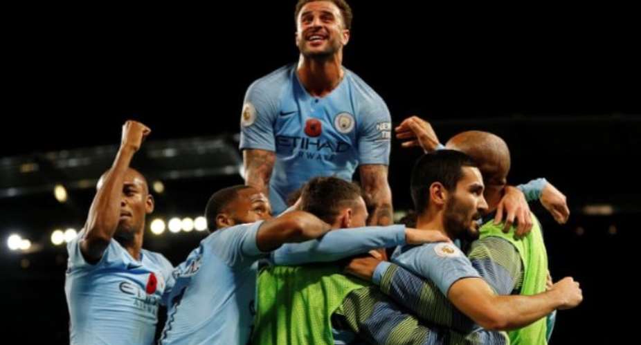 Manchester City's Ilkay Gundogan celebrates scoring their third goal with teammates. Photograph: Darren StaplesReuters