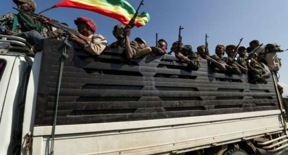 Troops loyal to the government ride in trucks to face Tigray People's Liberation Front forces - Reuters