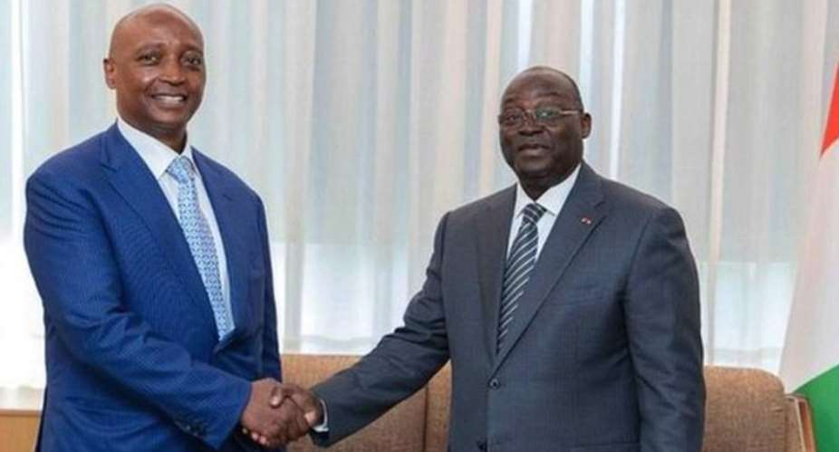 Confederation of African Football president Patrice Motsepe left met Ivory Coast's vice-president Tiemoko Meyliet Kone in Abidjan on Friday
