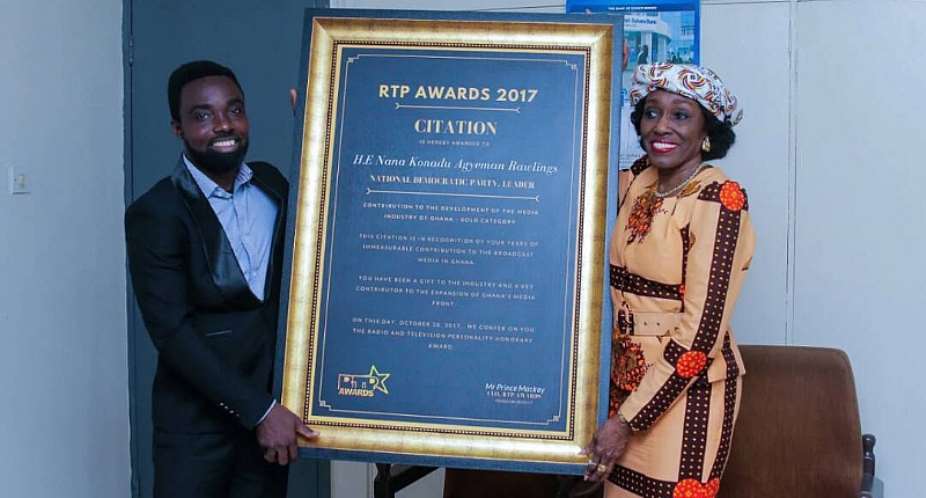 Nana Konadu Agyemang Rawlings receiving her award from Prince Mackay
