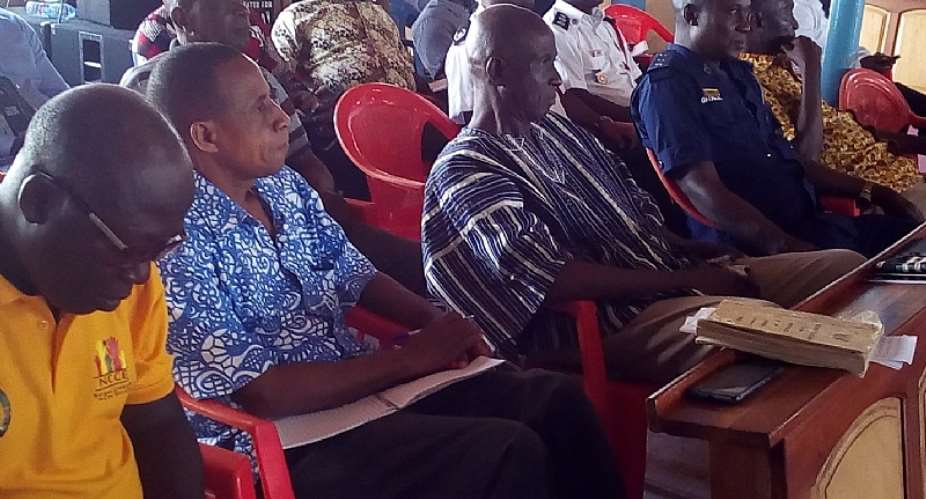 MCE for Berekum East, Mr. Kofi Adjei in smock with a cross-section of dignitaries at the Special Town Hall meeting