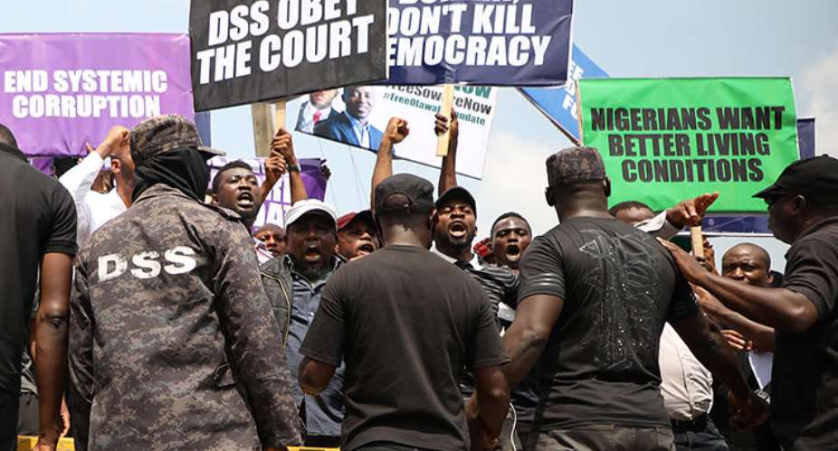 Demonstrators are seen outside the Department of State Services headquarters in Abuja, Nigeria, on November 12, 2019. Police fired on and attacked journalists covering that demonstration. AFPKola Sulaimon