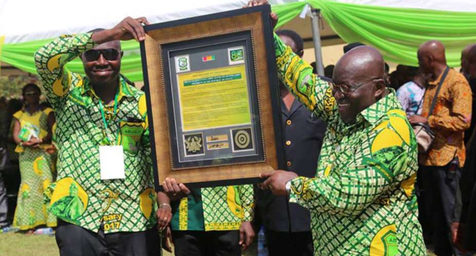 The ABUSCO management presenting a citation to President Akufo-Addo