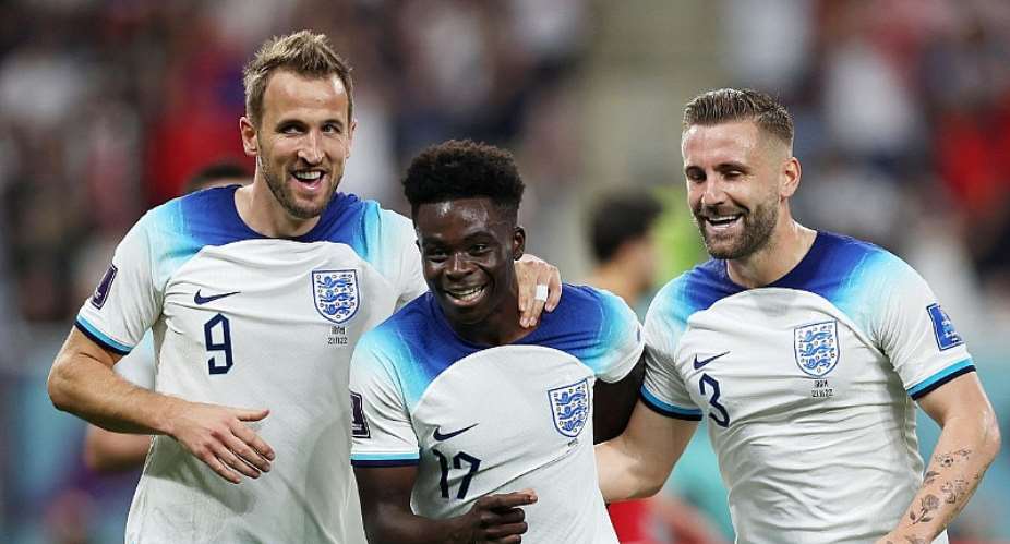 Bukayo Saka of England celebrates with teammates Harry Kane and Luke Shaw after scoring their team's fourth goal during the FIFA World Cup Qatar 2022 Group B match between England and IR IranImage credit: Getty Images