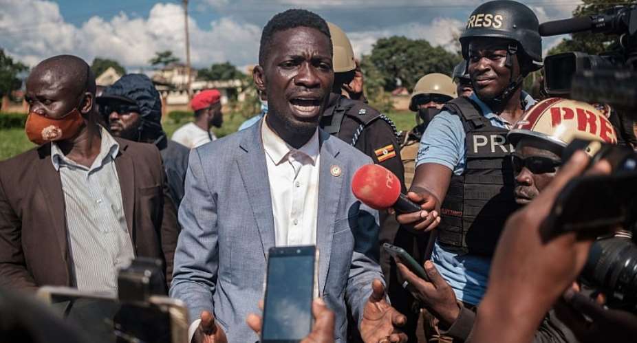 Ugandan musician-turned-politician Robert Kyagulanyi addresses the media after his car was shot at by police in eastern Uganda during his campaign. - Source: Photo by Sumy SadurniAFP via Getty Images