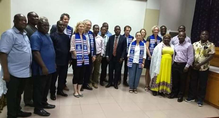 The delegation in a group photo with faculty and administrative members of the HTU