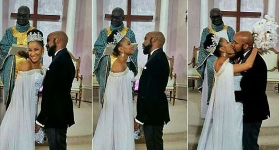Singer, Banky W Shares Passionate Kiss with Wife as they Hold Their White Wedding
