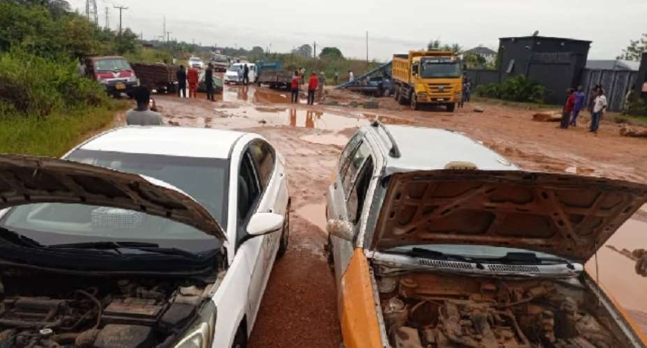 Scores of vehicles stuck on storm-ravaged gullies-riddled Dodowa-Afienya dirt road after Saturday heavy downpour