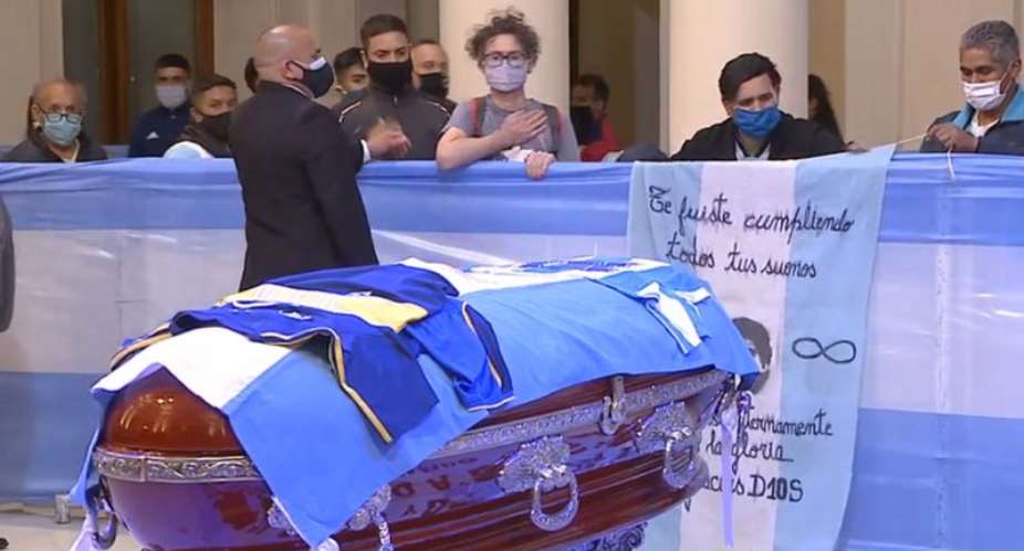 Some fans clapped, others wept, as they filed past Maradona's coffin