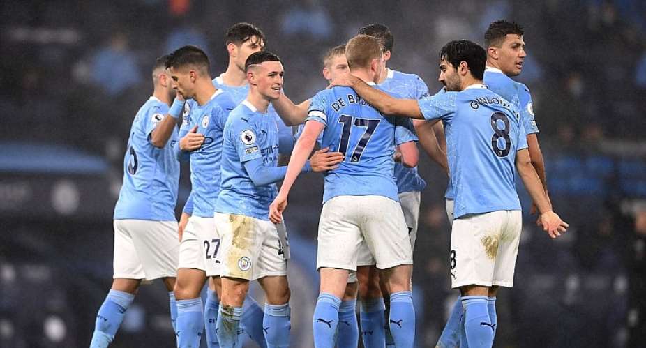 Phil Foden of Manchester City celebrates with teammates Kevin De Bruyne, Ilkay Guendogan and Rodrigo after scoring their team's first goal during the Premier League match between Manchester City and Brighton  Hove Albion at Etihad StadiumImage credit: Getty Images