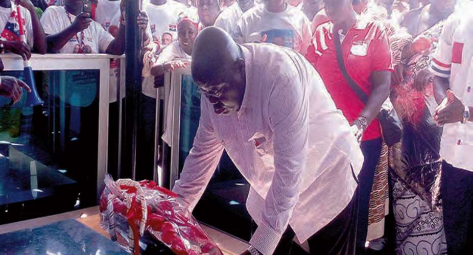 Nana Addo laying a wreath on the tomb of the late Stephen Krakue