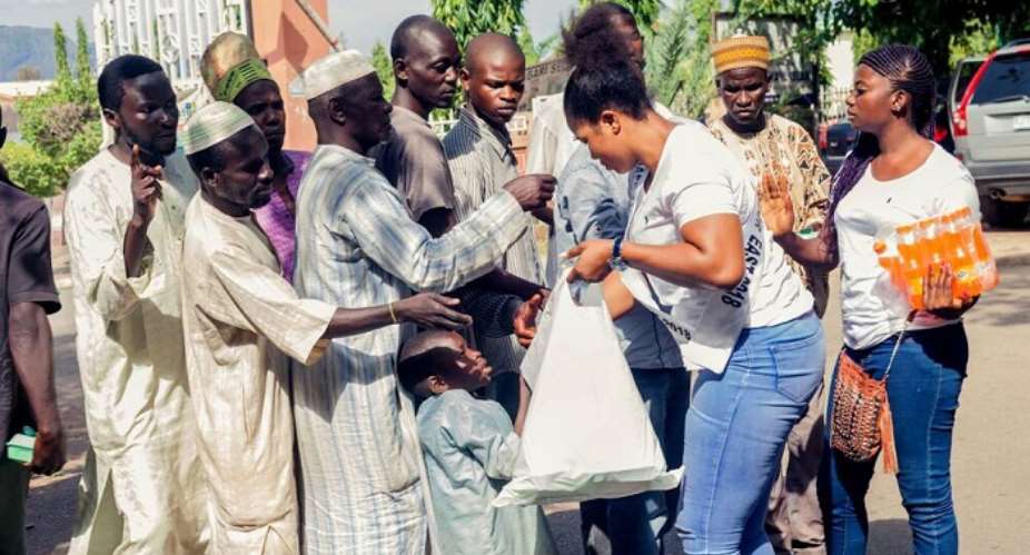 Chioma Uzofoh Feeds beggars on the Streets of Abuja