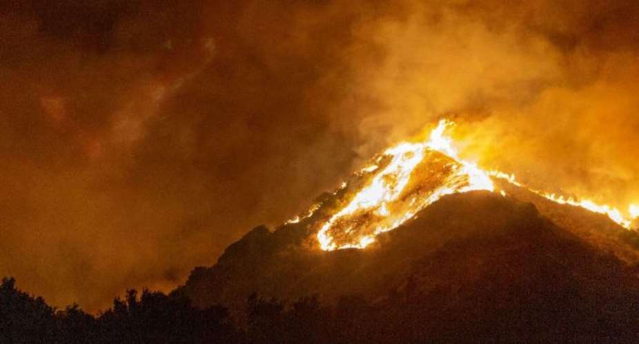 The Maria Fire burns on a hillside as it expands up to 8,000 acres on its first night on November 1, 2019 near Somis, California. Photo by David McNewGetty Images