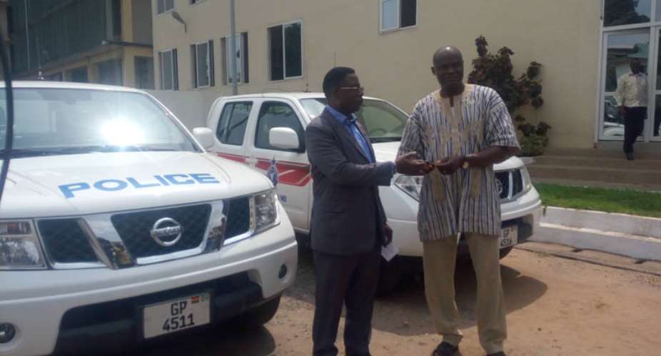 COP Prosper Agblor receiving the keys to the vehicles