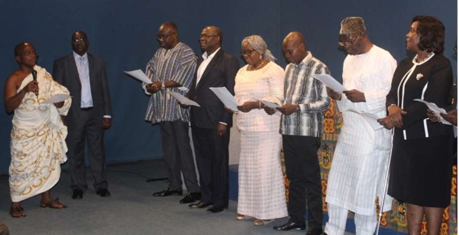The board members taking their oath of office