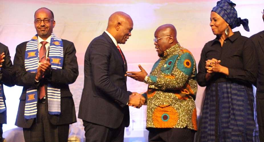 President Akufo-Addo in a handshake with Tony Elemulu 2nd L, Chairman, Tony Elemulu Foundation while other dignitaries look on
