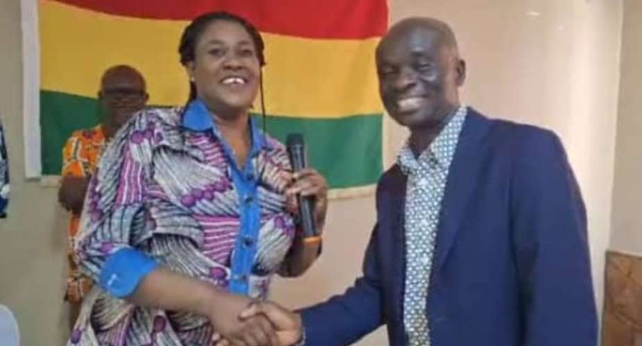 Prof. Agyemang in a handshake with Ghana High Commission, Mrs. Odunton