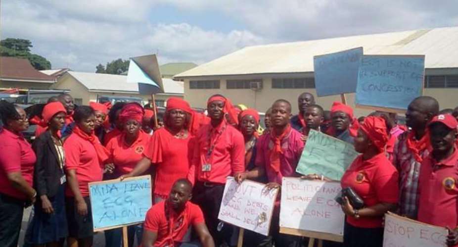 Workers of ECG displaying placards