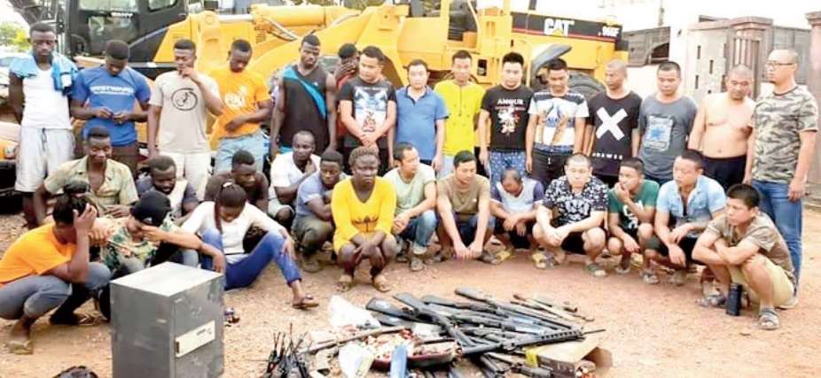 The alleged galamseyers and weapons retrieved from them