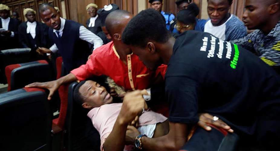 Fighting breaks out as security personnel attempt to re-arrest Nigerian activist and journalist Omoyele Sowore at the Federal High Court in Abuja, Nigeria, on December 6, 2019. Sowore and other activist-journalists have been jailed in Nigeria and Ethiopia amid a crackdown on free expression. ReutersAfolabi Sotunde