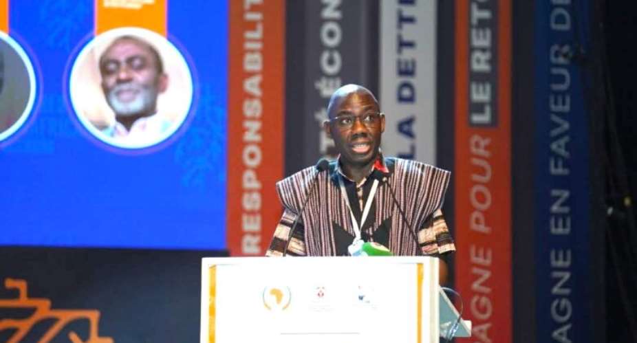 Photo – Oral Ofori speaking at the 9th Pan-African Congress in Lom, Togo /  9th Pan-African Congress