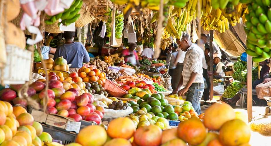 Fruit and vegetables at a market in Kenya. The WHO is pushing for consumption of fresh fruits and vegetables, whole grains, beans, fish and unsaturated fats. - Source: Shutterstock