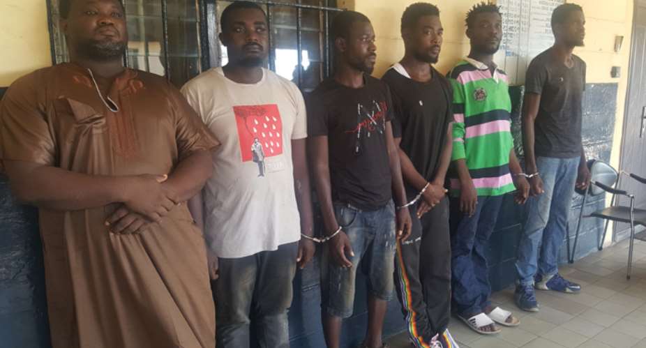 The suspected armed robbers in police custody