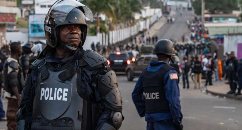 Police are seen in Monrovia, Liberia, on January 6, 2020. Liberian journalist Gloria Tamba has been in hiding since October. AFPCarielle Doe