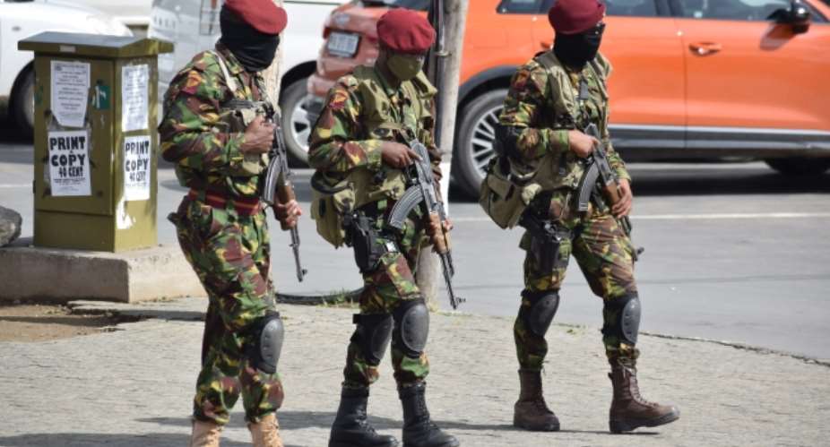 Lesotho soldiers on patrol as seen in Maseru, Lesotho, on January 29, 2021. Authorities in the city arrested a journalist, suspended a radio stations license, and raided another. (AFP/Molise Molise)