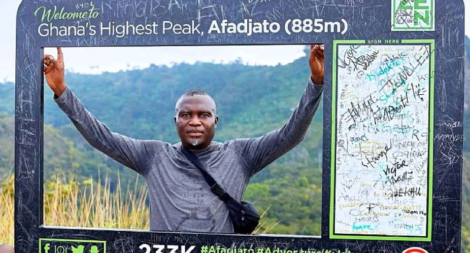 Journalist, Dela Ahiawor at the top of Mt. Afadja