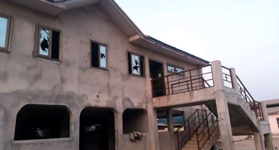 The angry youth shattered glass windows on this uncompleted building belonging to the Rev Owusu-Bempah