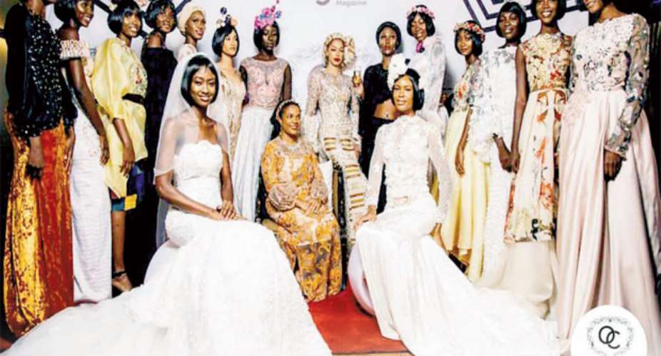 Ophelia Crossland in a pose with models in some of her designs