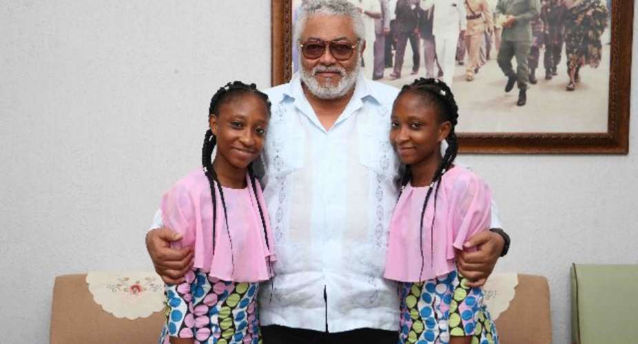 Lydia and Linda Awui with Former President Jerry John Rawlings