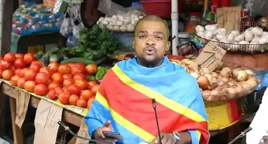 Congolese journalist John Kabamba is seen presenting his show, draped in the national flag. The countrys media regulator said Kabamba had failed in his professional duty because he did not correct a guest speaker. (Photo: Credit withheld)