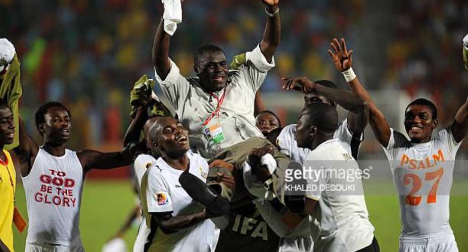 Ghanas players carry their head coach Sellas Tetteh (C) as they celebrate winning the FIFA U-20 World Cup in Cairo on October 16, 2009. Ghana overcame Brazil 4-3 on penalties in the final match, becoming the first African side to win the tournament. AFP PHOTO/KHALED DESOUKI (Photo credit should read KHALED DESOUKI/AFP via Getty Images)
