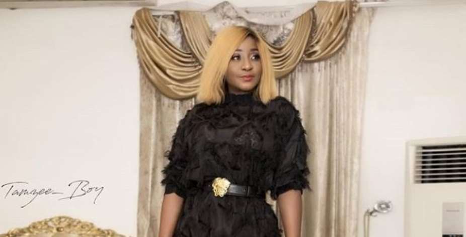 Nollywood actress, Ini Edo Looks Stunning in Stylish Feather Outfit