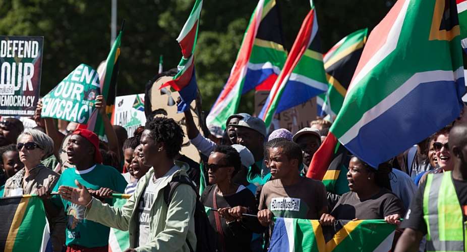 Anti-corruption protesters march on Parliament in Cape Town in 2017. - Source: shutterstockAqua Images