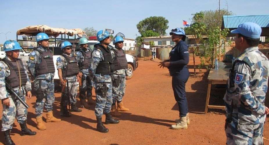 Vera Ayensu, a UN police officer from Ghana, instructs her colleagues in Wau.
