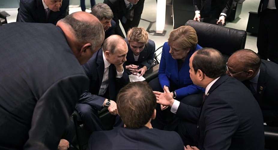 German Chancellor Angela Merkel speaks with Russian President Vladimir Putin during the International Libya Conference in Berlin, Germany, 19 January 2020 - Source: EPAALEXEI NIKOLSKYSPUTNIKKREMLIN
