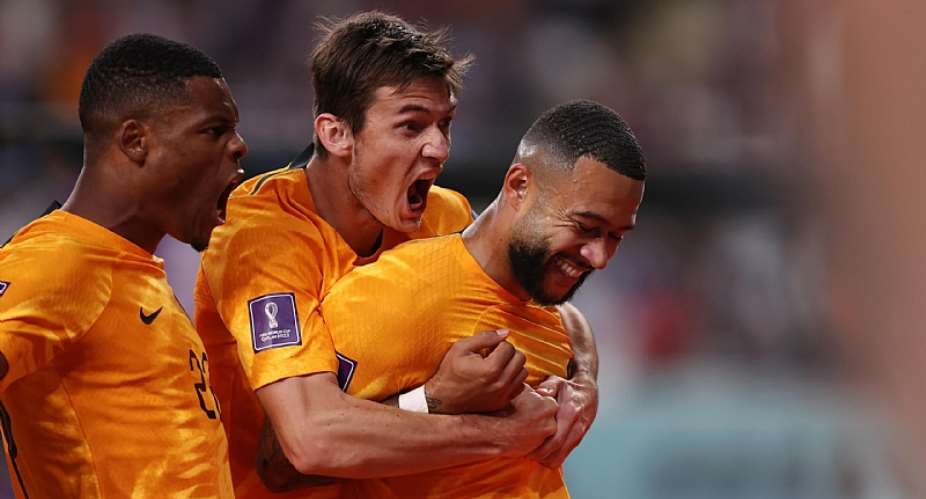 Memphis Depay of Netherlands celebrates with teammates after scoring the team's first goal during the FIFA World Cup Qatar 2022 Round of 16 match between Netherlands and USA at Khalifa International Stadium on December 03, 2022 in Doha, QatarImage credit: Getty Images