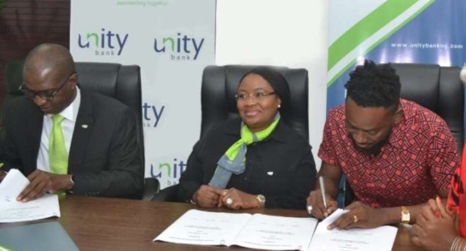 PHOTO NEWS: Unity Bank signs Adekunle Gold as Brand Ambassador