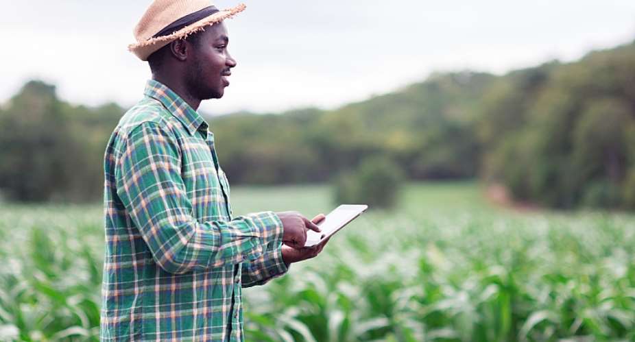 The digital economy includes small holder farmers being able to access finance on a mobile device without having to go to a bank. - Source: Shutterstock