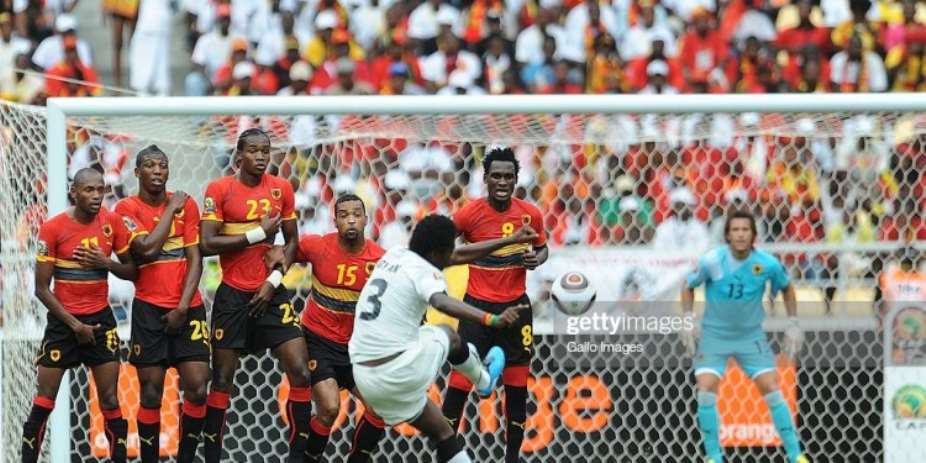 ANGOLA, LUANDA - JANUARY 24: Asamoah Gyan of Ghana kicks a free kick while Angola players looks on during the Africa Cup of Nations Quarter Final match between Angola and Ghana from the November 11 Stadium on January 24, 2010 in Luanda, Angola. Photo by Lefty ShivambuGallo ImagesGetty Images
